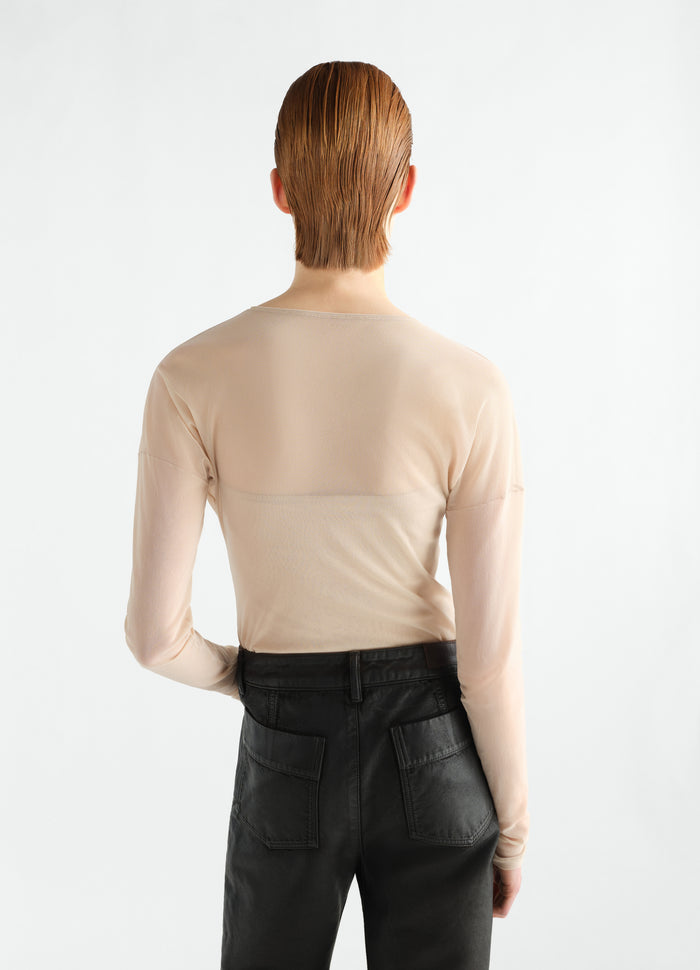 Long-sleeve ballerina beige mesh jersey top LEMAIRE worn by model back view with black pants