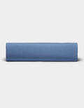 A neatly folded Bamboo Jersey Sheet Set by Cozy Earth is displayed against a plain, light gray background.|Color:Sailor