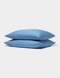 Two neatly stacked Cozy Earth Bamboo Jersey Pillowcases in light blue are displayed on a plain white background.|Color:Sailor