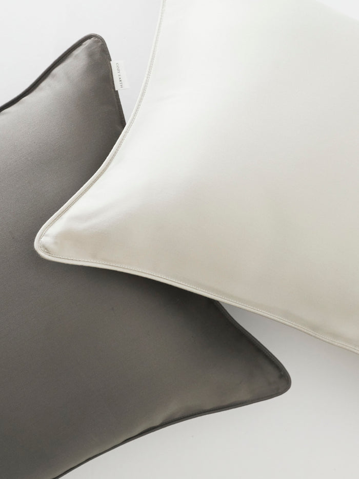 Close up of charcoal and light grey travel pillowcases |Color:Charcoal