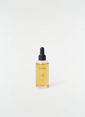 Bois D'Ombre perfume dropper bottle with amber liquid and black cap LEMAIRE on white background