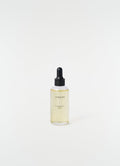 Cardamome Terre scented oil dropper bottle with black cap by LEMAIRE on plain white background