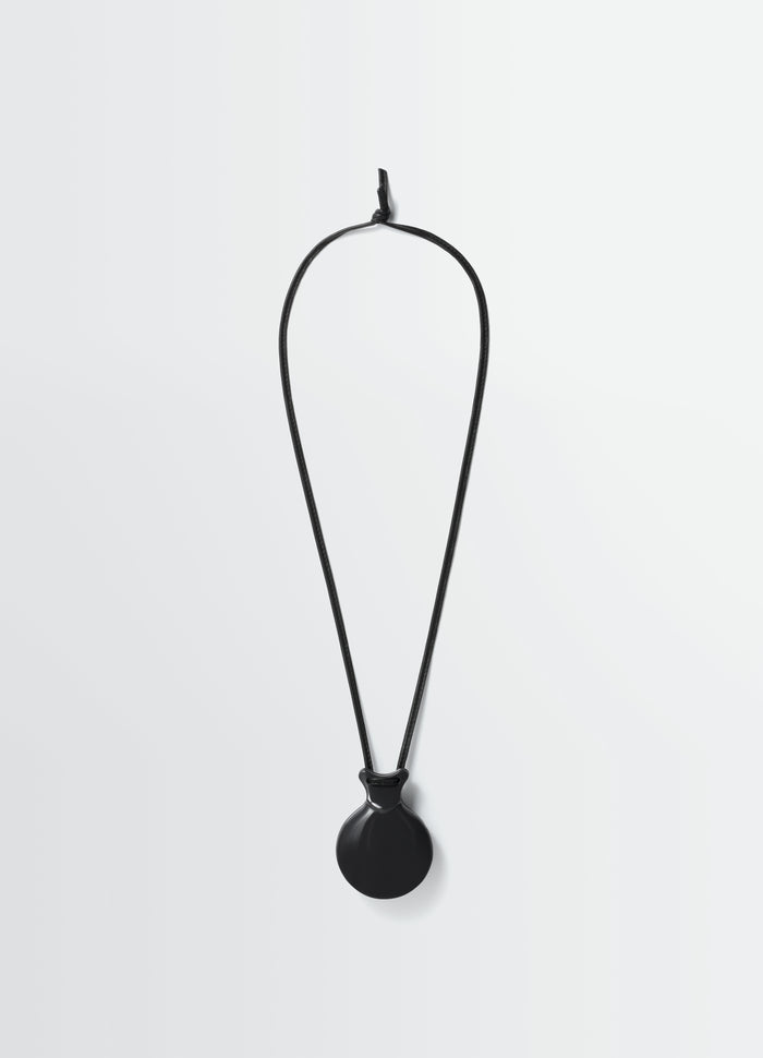 Castanet mirror pendant necklace in black leather by LEMAIRE front view on white background