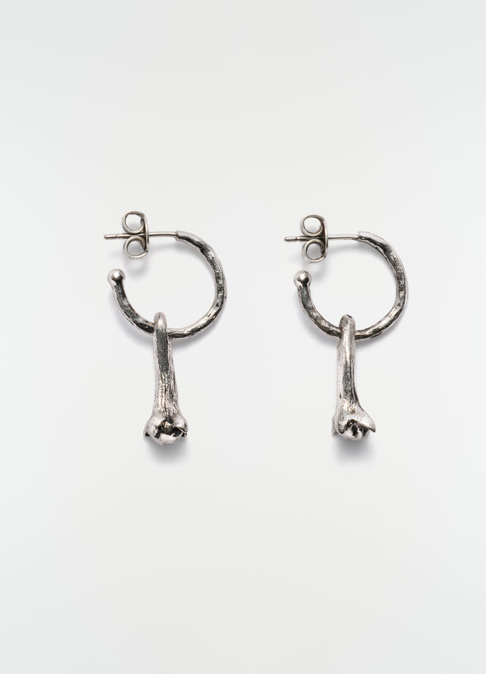 Clove silver metal earrings with textured hoop and clove detail by LEMAIRE on white background