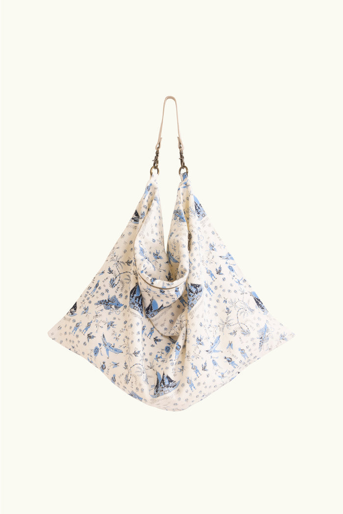Cream tote bag with a blue limited edition percussion print on a white background
