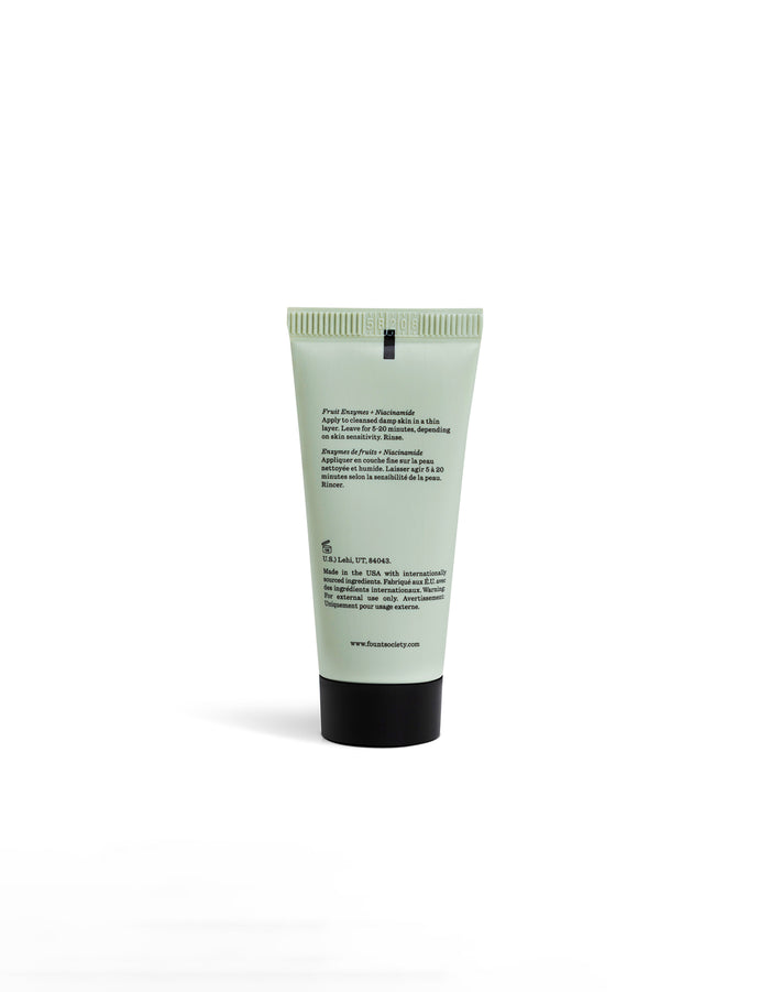 A light green tube of Cozy Earth's Enzyme Mask stands upright on a white background, with black text on the back label listing ingredients and instructions. The website and company details are displayed at the bottom.|Size:Mini