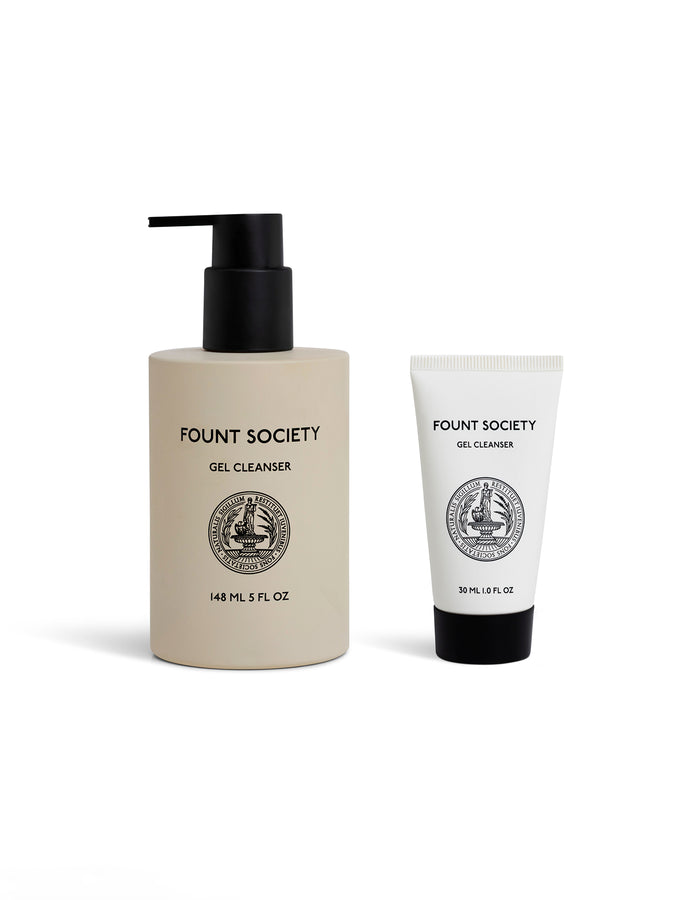 Two Cozy Earth skincare products: the Gel Cleanser in a 148 ml beige bottle with black pump and a 30 ml white tube, both featuring black logo and text, are displayed on a white background. |Size:Full Size