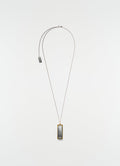 Harmonica necklace LEMAIRE silver and gold metal detail plain white background