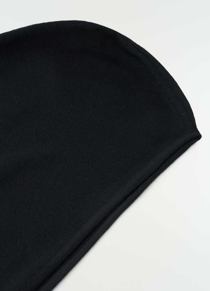 Head scarf in black fine wool LEMAIRE close-up detail on plain white background