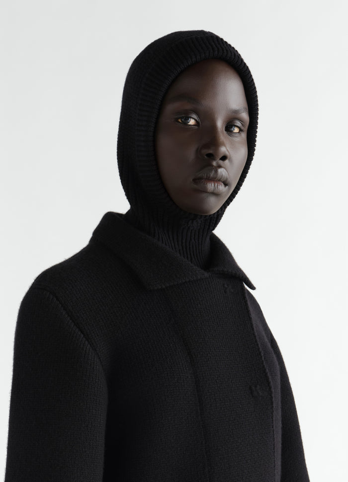 Balaclava in black worsted wool by LEMAIRE worn by model front close-up on white background