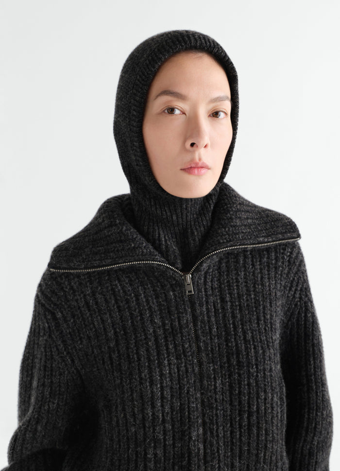 Balaclava in black alpaca and yak wool blend worn by model front close-up LEMAIRE