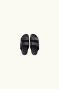 Pair of black slides leather on a white background