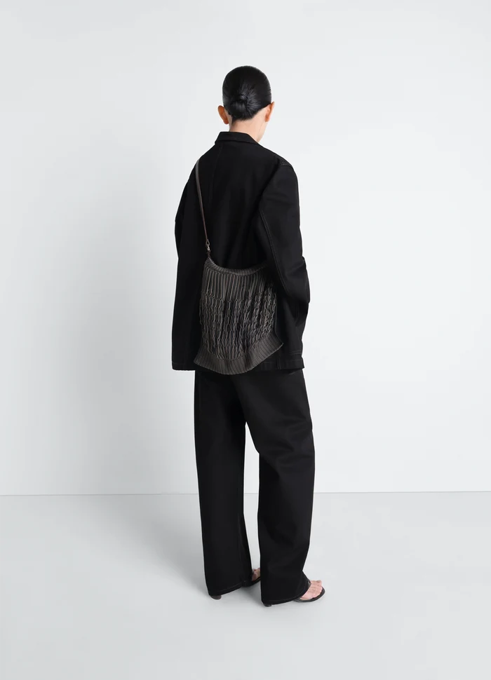 Lemaire Large Crossbody Filt Net in Black Nylon Mesh, Leather, model shot, back view crossbody worn by model