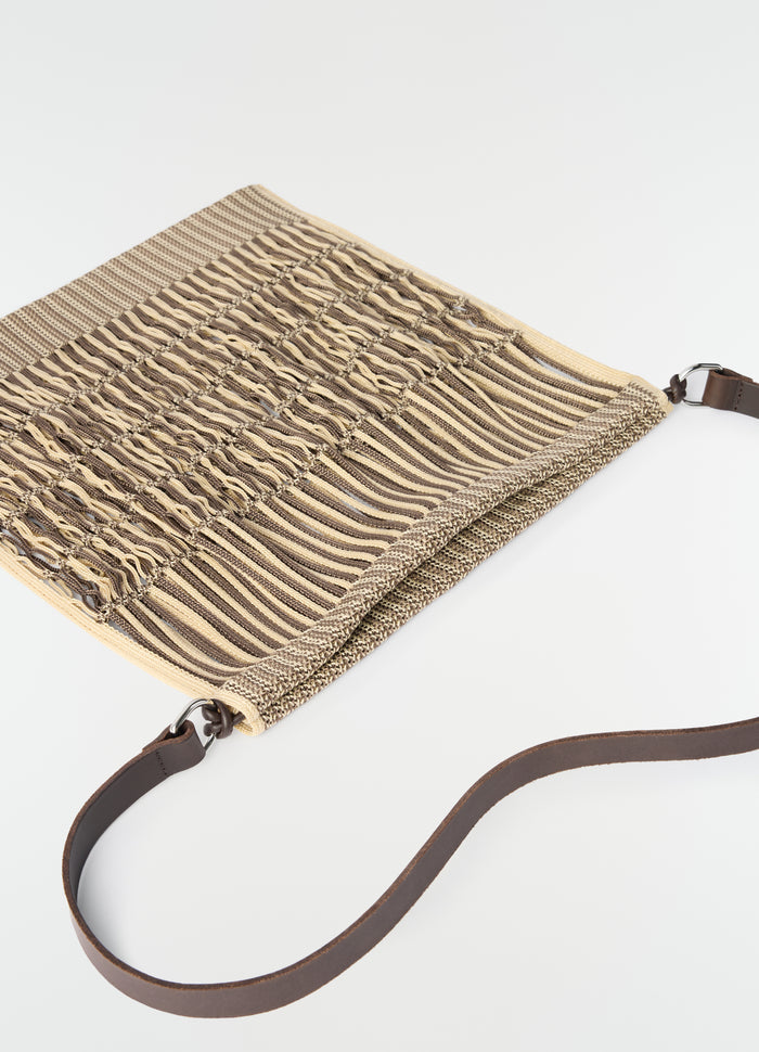 Large crossbody filt net shopping bag LEMAIRE in beige and brown cotton with leather strap flat lay on white background