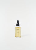 Lavande Écorce dropper bottle with yellow liquid by LEMAIRE on plain white background close-up