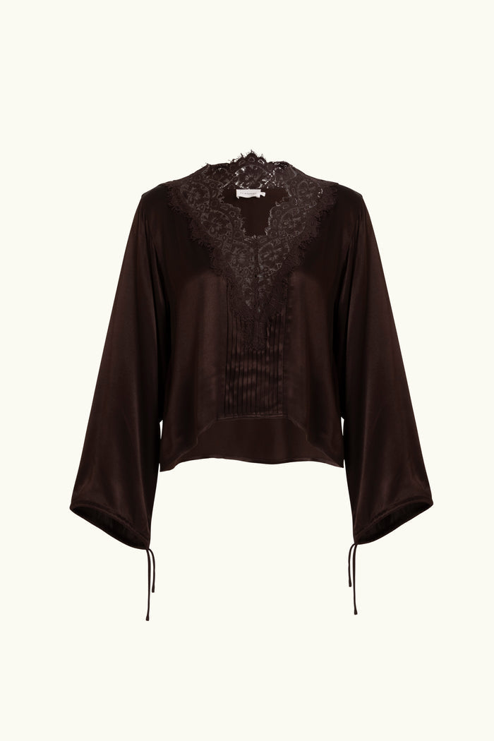 Brown lace-lined long sleeve top on a white background