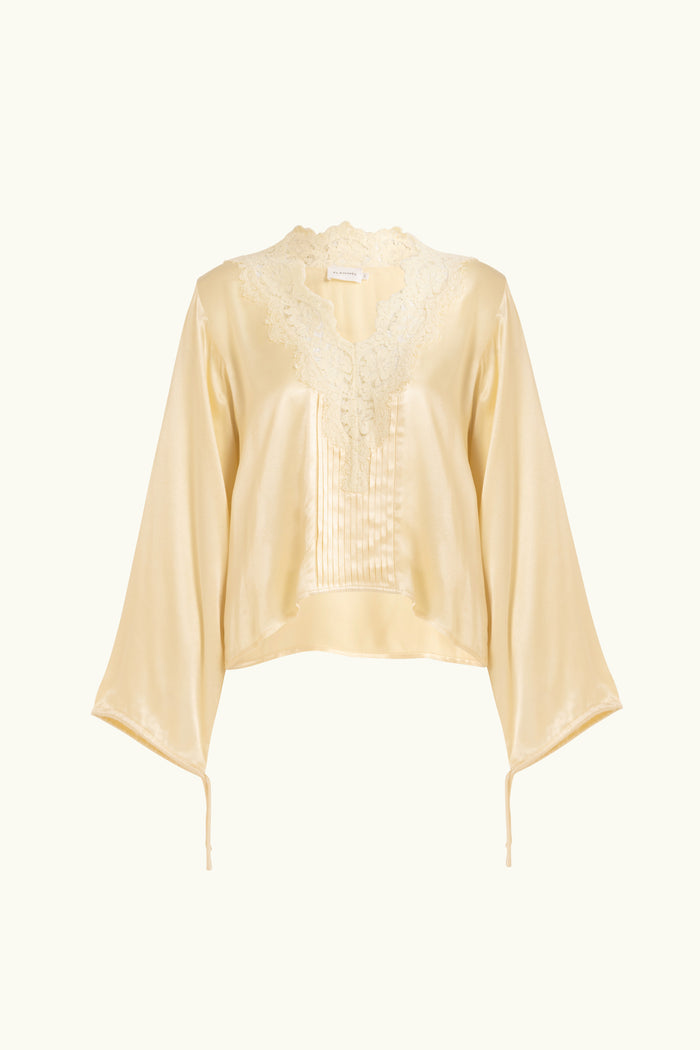 Vanilla lace-lined long sleeve top on a white background