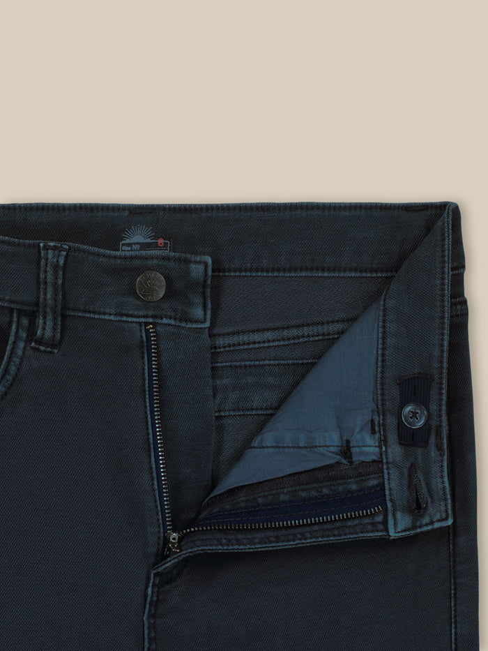 Close up of dark navy pants with an adjustable waistband