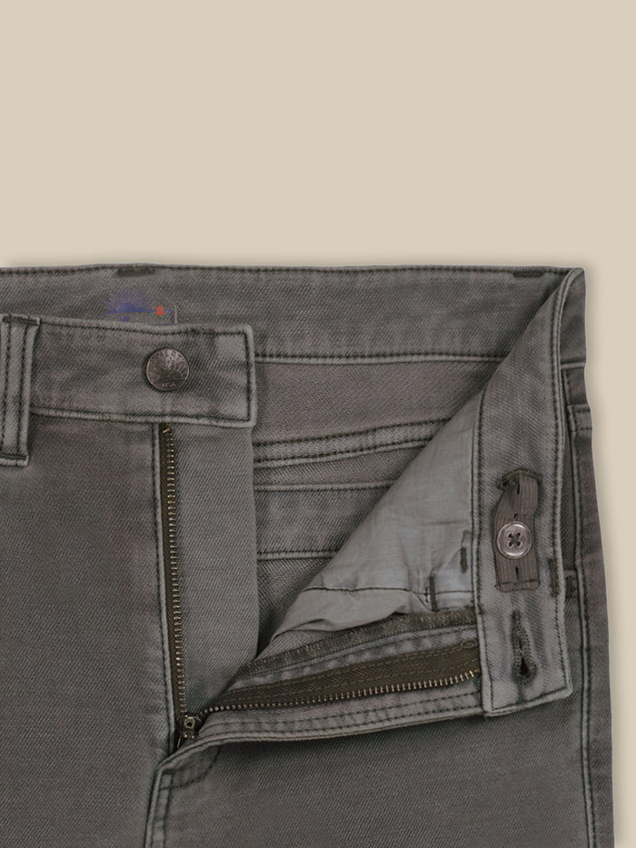 Close up of dark grey pants with an adjustable waistband