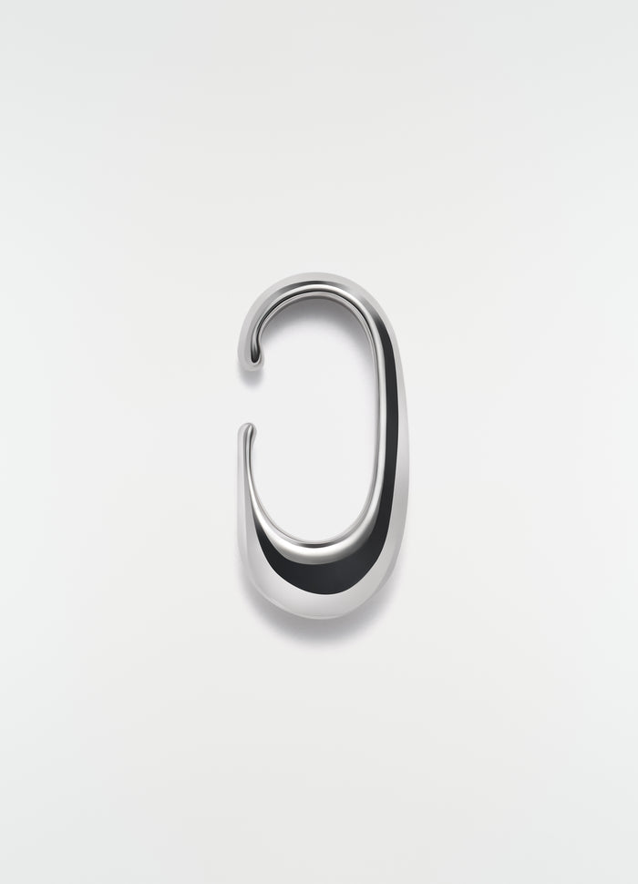 Long silver metal drop earcuff LEMAIRE shot on plain white background detail view