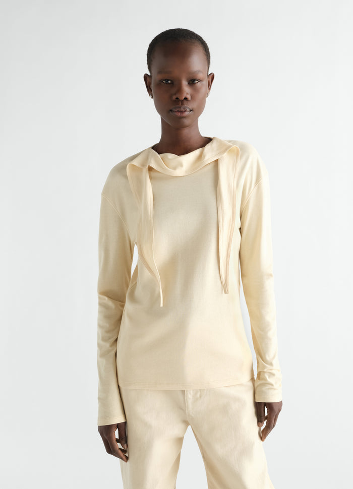 Long-sleeve cream silky jersey crepe scarf top LEMAIRE worn by model front on white background