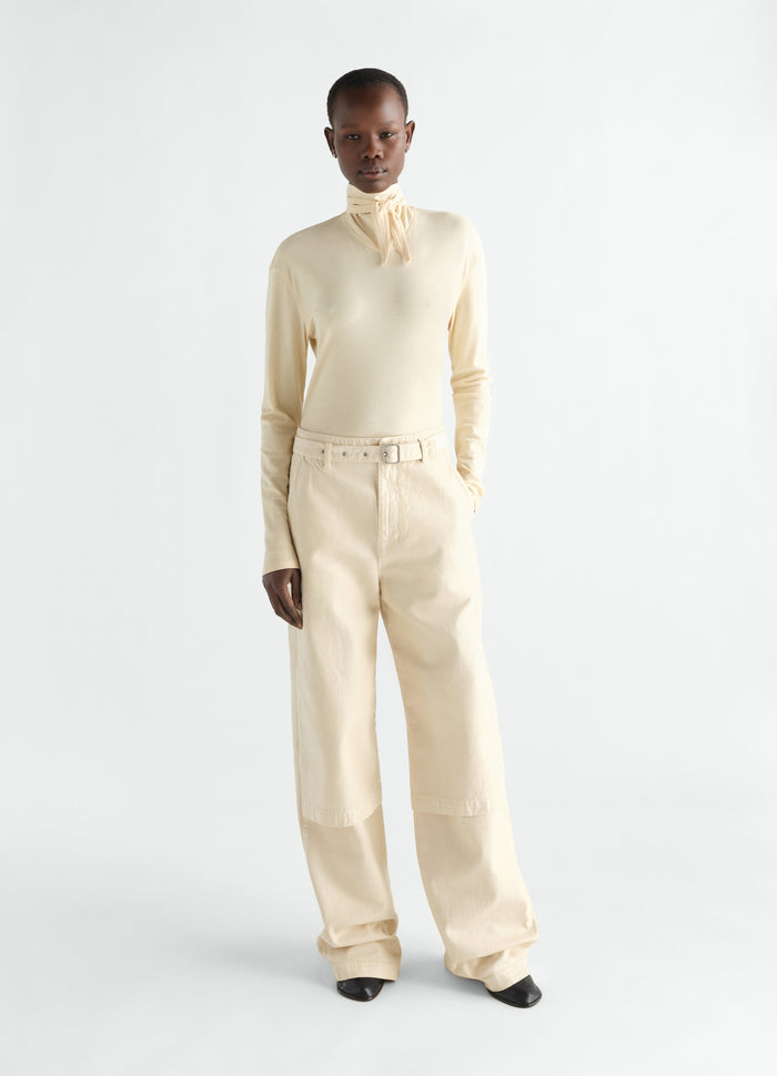 Long-sleeve cream scarf top in silky jersey crepe by LEMAIRE worn by model front view