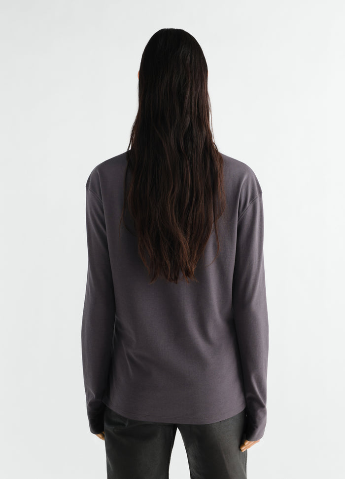 Long-sleeve scarf top in dark grey silky jersey crepe by LEMAIRE worn by a model back view