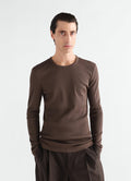 Long-sleeve ribbed jersey top in dark brown worn by model front view LEMAIRE