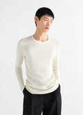 Long-sleeve ribbed jersey top in cream worn by model front view LEMAIRE