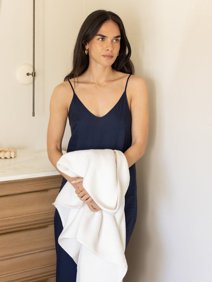 Woman holding seashell luxe bath sheet |Color:Seashell