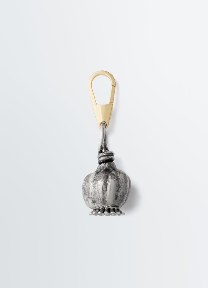 Maxi Thistle Bag Charm by LEMAIRE in silver and gold metal with detailed thistle design close-up on white background