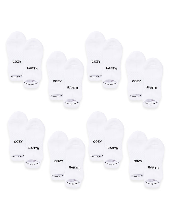 Eight pairs of white Essential Ankle Socks by Cozy Earth are arranged in rows, each with "COZY" on one sock and "EARTH" on the other in black text near the toes. |Color:White