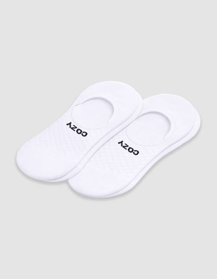 Women's Essential No-Show Sock by Cozy Earth: white socks with a quilted pattern and "COZY" in black near the opening, shown on a plain white background.|Color:White