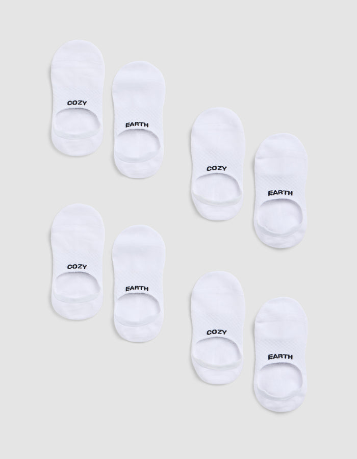 Eight pairs of white socks from the Cozy Earth Essential No-Show Sock 4-Pack are arranged on a light grey background, each sock featuring "COZY" or "EARTH" in black text at the toes.|Color:White