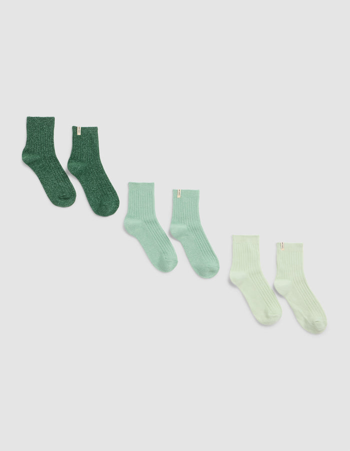 Three pairs of Cozy Earth’s Plush Lounge Quarter Socks in green shades, arranged diagonally from dark on the left to light on the right, displayed against a plain light background.|Color:Jade/Wintergreen/Pistachio Cream