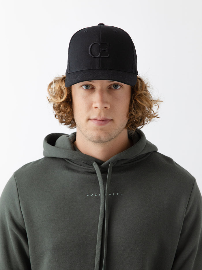 Man wearing a black cap with a CE logo on a light gray background |Color:Black