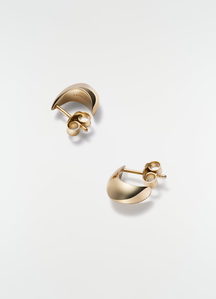 Micro Drop gold-tone metal micro drop earrings by LEMAIRE on plain white background close-up detail