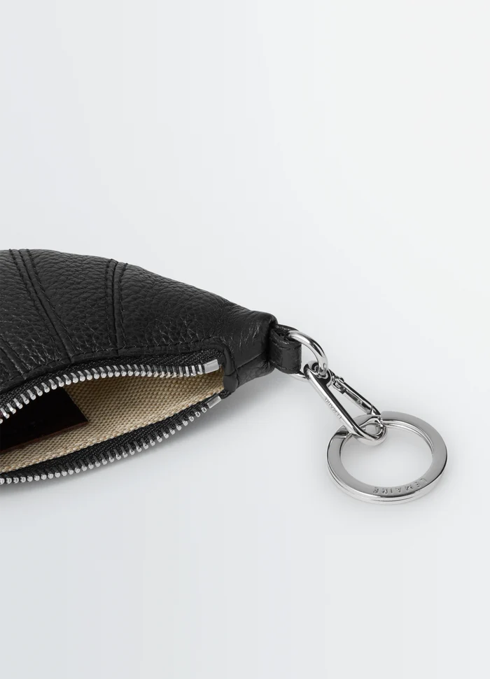 Mini Croissant Keyring in Black Grained Leather, product shot, detail shot of zipper textured leather finish