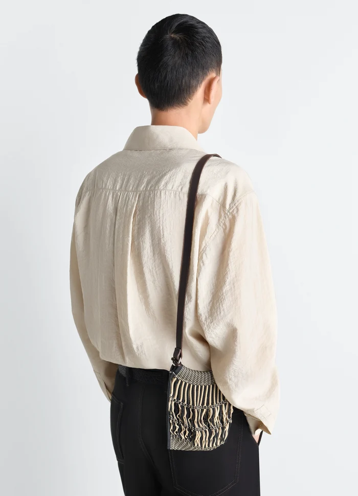 Lemaire Mini Crossbody Filt Net Bag in Nylon Mesh with Leather Strap, model shot, back view woven texture detail