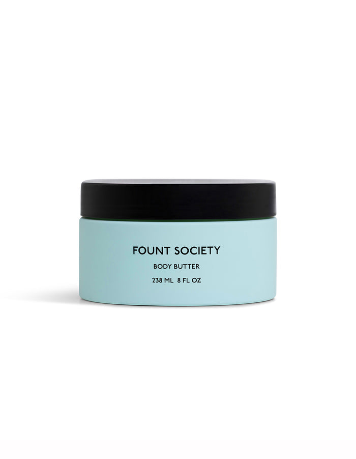A light blue jar of Cozy Earth Body Butter with a black lid, labeled "Body Butter" and "238 mL / 8 fl oz," is set against a plain white background.|Size:Full Size