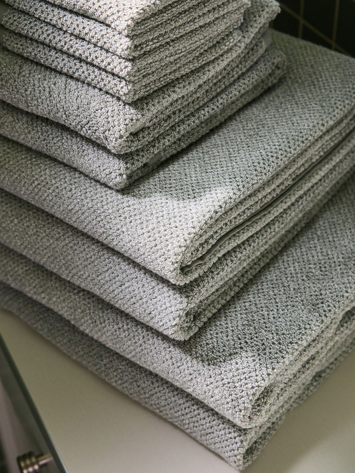 A stack of various sizes of Heathered Sage Nantucket Towels. |Color:Heathered Sage