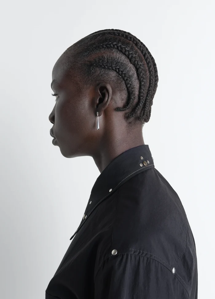 Piercings Set in Silver in Rhodium-Plated Silver, model shot, side profile view styled with buttoned shirt