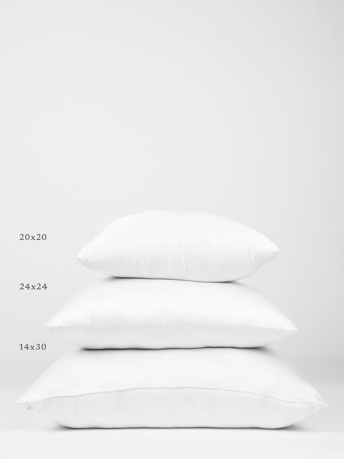 Three Cozy Earth Premium Down Alternative Inserts of different sizes are stacked on top of each other against a white background. The sizes are labeled on the left side as 20x20 (top), 24x24 (middle), and 14x30 (bottom). |Size:14" x 30"