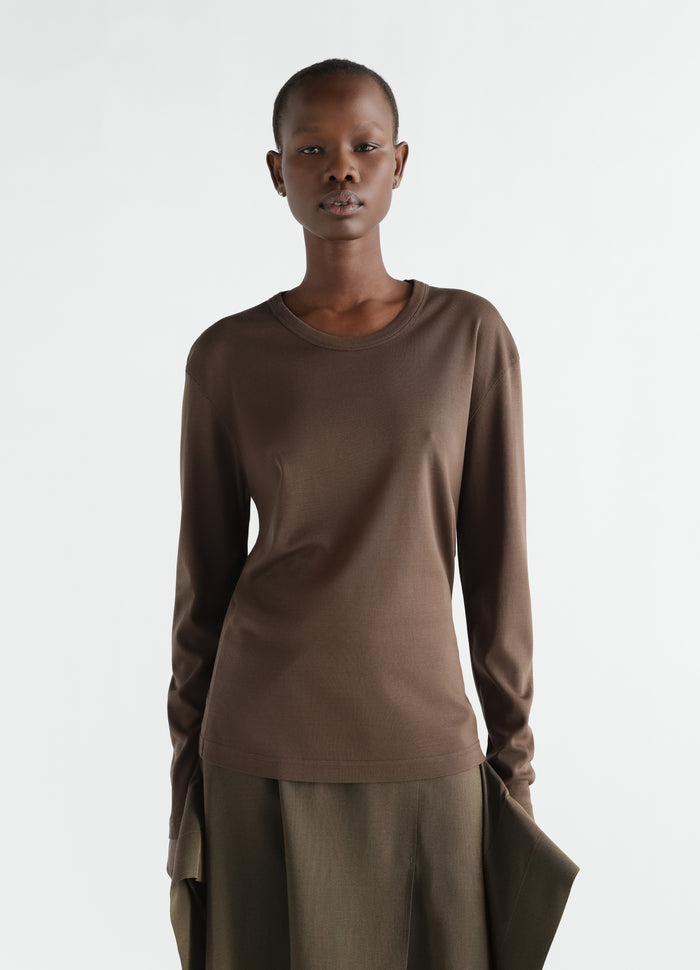 Rib long sleeve brown jersey top by LEMAIRE worn by model front view with relaxed fit