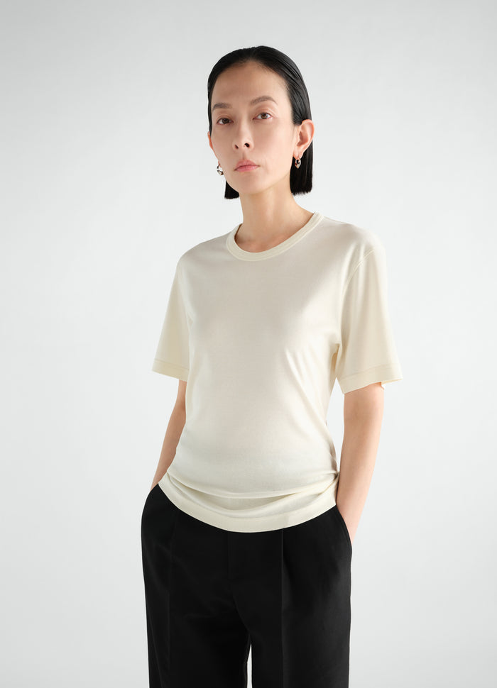 Rib jersey cream short sleeve T-shirt worn by a model front view LEMAIRE main look