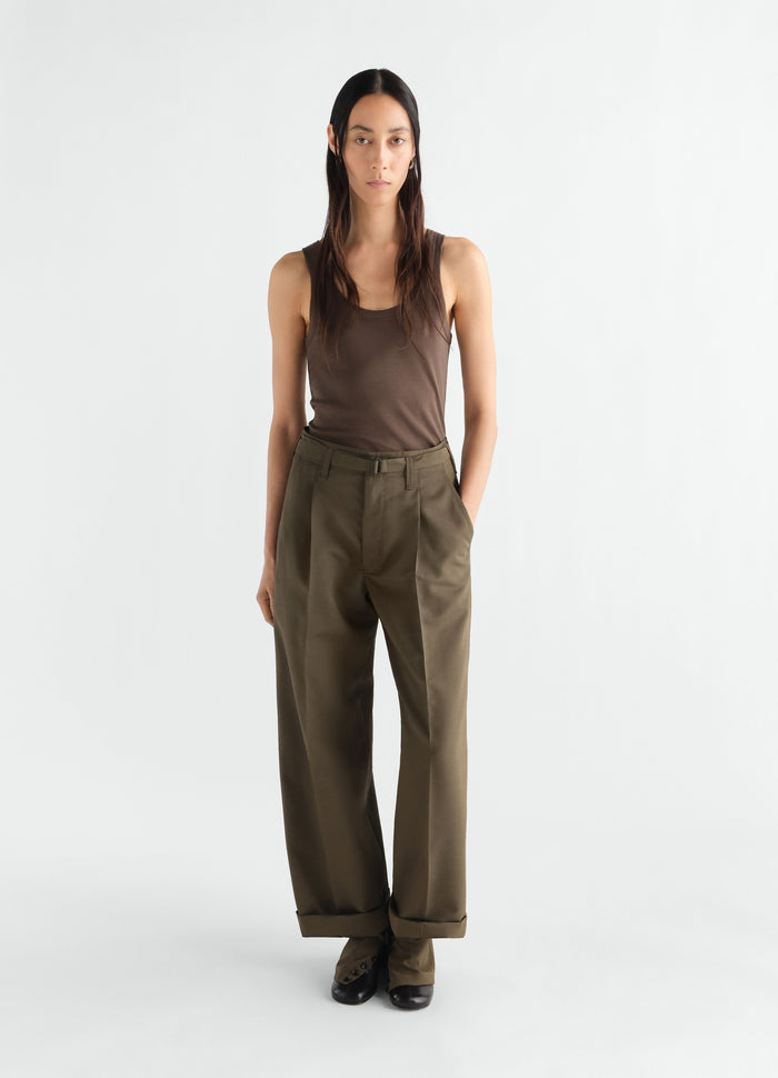 Rib brown jersey tank top by LEMAIRE worn by a model with olive wide-leg trousers front view