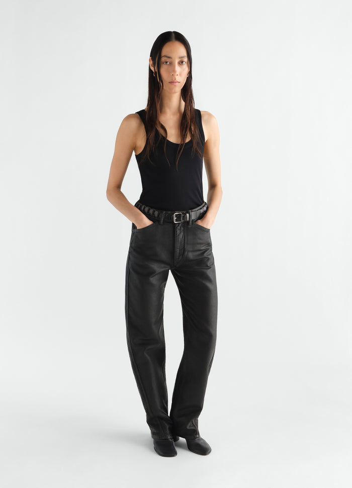 Rib black jersey tank top LEMAIRE worn by model with black leather pants front view