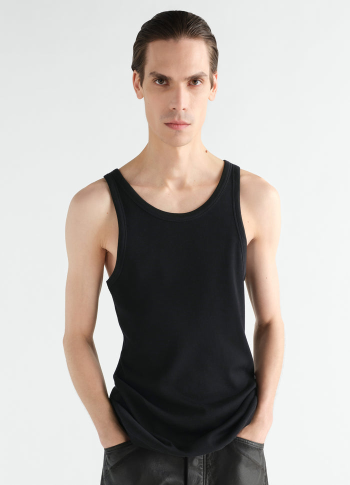 Tank top in black ribbed jersey worn by model front view LEMAIRE main look