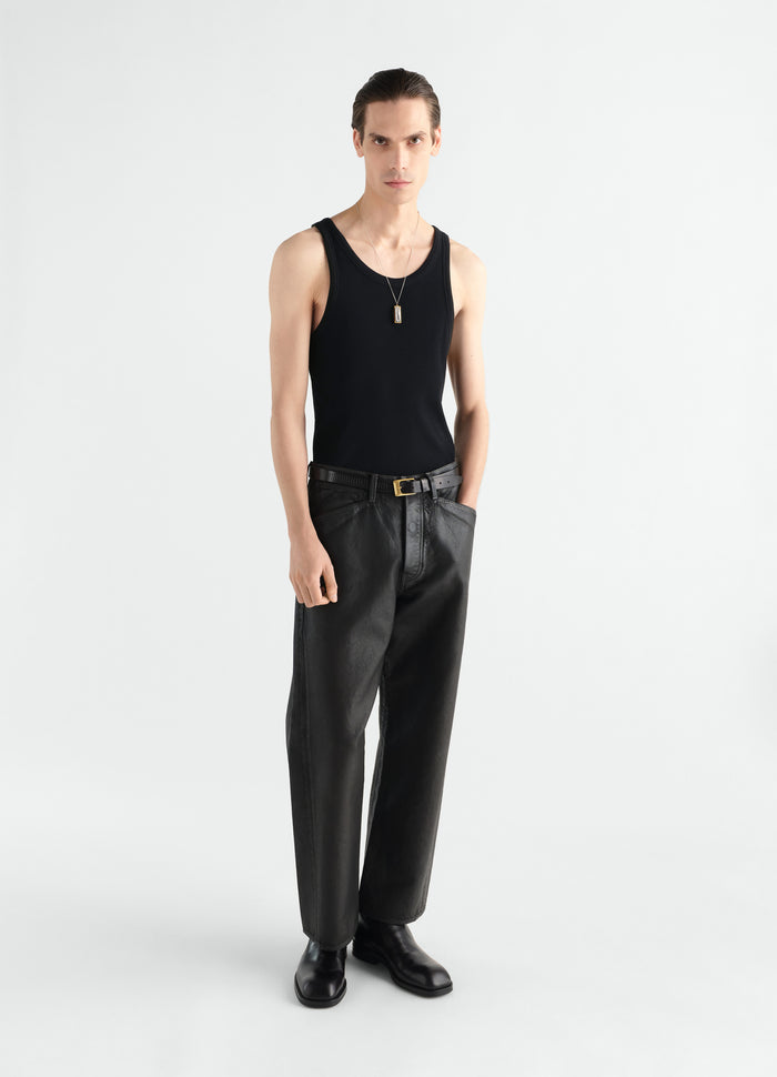 Tank top in black ribbed jersey LEMAIRE worn by a model front view with black leather pants and boots