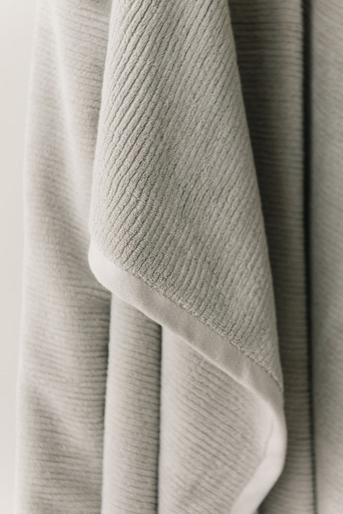 Ribbed Terry Bath Sheets in the color Light Grey. Photo of the towel is taken close up. |Color:Light Grey